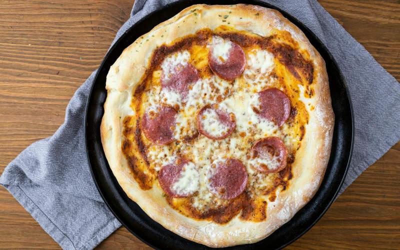 The Real Reason Your Homemade Pizza Crust Is Never as Chewy as Your Favorite Pizzeria